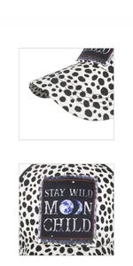 Close-up of ponytail baseball cap featuring Stay Wild Moon Child patch and spotted pattern