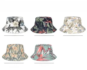 Flat lay of five cotton sun hats featuring tropical floral and leaf print patterns