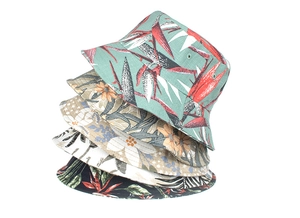 Detail showing various tropical floral print patterns on wide brim cotton sun hats