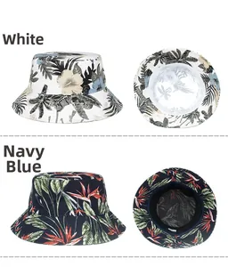 Detail view of cotton bucket hats with tropical floral prints in white and navy blue