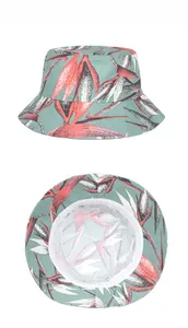 Detail view of tropical floral print sun hat with wide brim and green leaf patterns