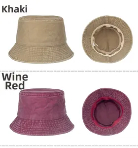 Detailed view of washed cotton bucket hats in khaki and wine red showing high-quality stitching