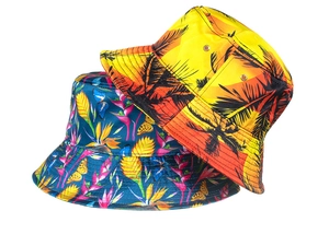 Detail of wide brim bucket hats featuring tropical palm trees and floral print patterns
