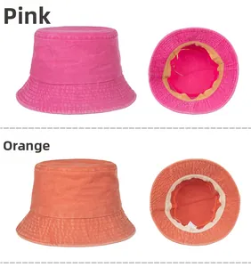 Detail view of washed cotton sun hat showing rose red and orange colors and inner lining
