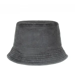 Detail of washed cotton fisherman hat featuring metal eyelets and multi-row stitching