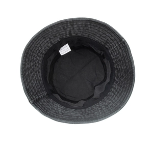 Close-up of the 100% cotton inner lining and sweatband of the washed black bucket hat