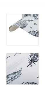 Detail of white baseball cap showing feather print and precision stitching on the curved brim