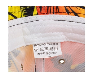 Macro detail of sun hat interior showing the 100% polyester care label and floral lining