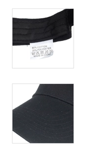 Détail de l'étiquette en 80% coton et 20% polyester sur une visière de soleil noire