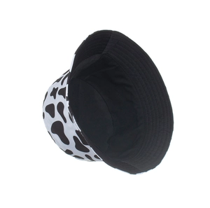 Close-up of cow print bucket hat showing fabric texture and neat inner lining detail
