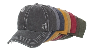 Detail of multi-color washed canvas baseball caps with distressed ripped edges and stitching