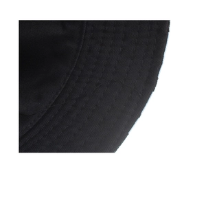 Detailed view of reinforced parallel stitching on a black sun hat wide brim for durability