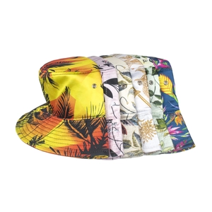 Stack of assorted summer satin bucket hats with tropical floral and botanical print patterns