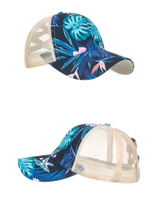 Detail view of navy tropical floral print baseball cap with cream mesh and adjustable strap