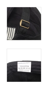 Detail view of the bronze metal adjustment buckle and 100% cotton washing label on the black cap