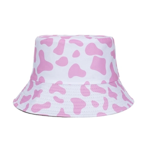 Pink cow print wide brim sun hat with UV protection for women in a classic bucket style