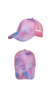 Detail view of tie-dye baseball cap with pink mesh back and breathable mesh panels