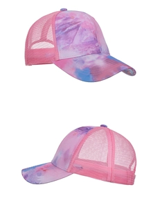 Detail view of pink tie-dye baseball cap with breathable mesh and vibrant printed patterns
