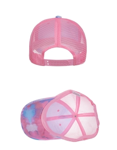 Detail view of pink tie-dye trucker hat with breathable mesh and adjustable snapback closure