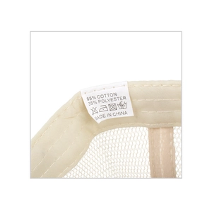 Detail of internal mesh structure and care label on beige cotton polyester hat