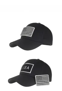 Close-up of black baseball cap with removable American flag and USA velcro patches