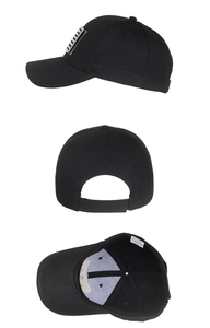 Detail view of black baseball cap showing interior material label and side stripe patch