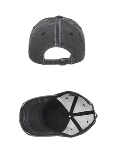 Detail view of washed denim baseball cap showing contrast stitching and adjustable metal buckle