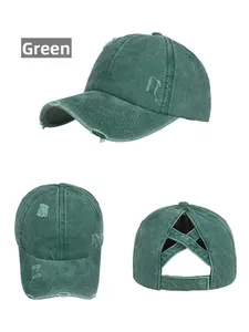 Detailed view of dark green washed cotton baseball cap with criss-cross ponytail hole design