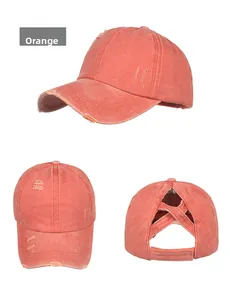 Detailed views of orange washed cotton ponytail baseball cap with distressed torn edges