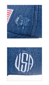 Dettaglio del cappellino in denim lavato con ricamo USA e toppa della bandiera americana