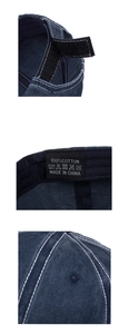 Detail of vintage navy baseball cap showing velcro strap, wash label, and contrast stitching