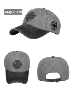 Close-up detail of vintage washed cotton baseball cap with maple leaf embroidery