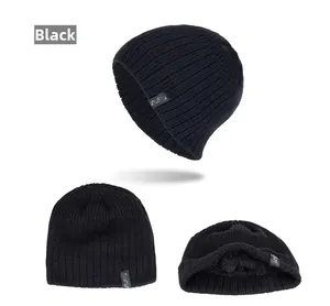 Detailed view of black ribbed knit beanie with soft warm lining and fashion label