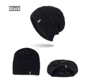 Detail view of black cable knit beanie featuring thick thermal fleece lining and sport tag