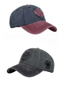 Detailed macro view of washed cotton baseball caps with Canadian maple leaf embroidery