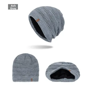 Detail view of heather grey knit beanie with black fleece lining and sport leather label