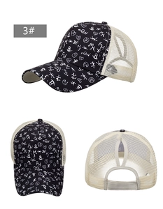 Multiple views of a ponytail hole trucker hat with white graffiti patterns on black fabric