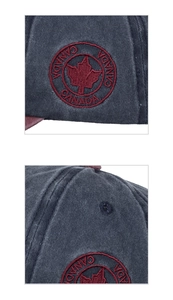 Detailed close-up of embroidered Canada maple leaf patch on washed cotton baseball cap