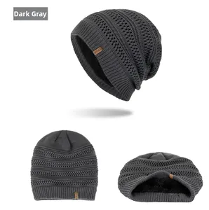 Detail view of dark grey knitted beanie with thick fleece lining and Sport leather label