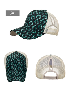 Detail view of floral mesh ponytail baseball cap showing the breathable net and unique hair opening