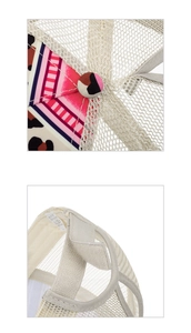 Detail of floral print mesh cap showing fabric texture and cotton polyester wash label