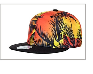 Detail of tropical sunset print with palm trees on flat brim snapback baseball cap