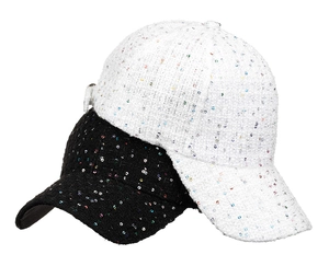 Detail of black and white tweed baseball caps with shimmering colorful sequins