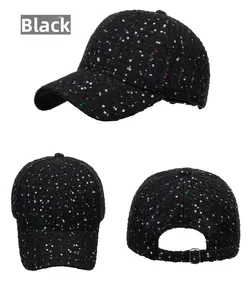 Detailed view of black tweed baseball cap with colorful sequins and metal adjustment buckle