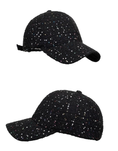 Detail view of black tweed baseball cap with colorful sequins and six-panel design