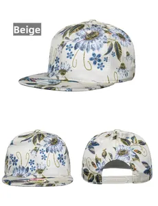 Detail view of beige snapback hat with blue daisy print showing front and side profile