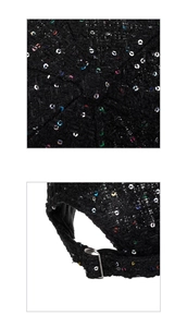 Detail of black tweed baseball cap featuring colorful sequins and top button craftsmanship
