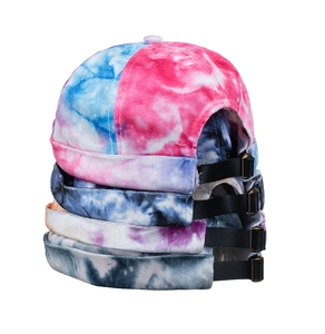 Macro shot of colorful tie-dye Miki hats with adjustable leather strap and bronze buckle