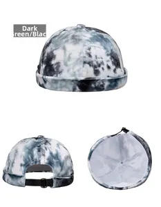 Detail view showing dark green tie-dye texture and adjustable metal buckle on beanie hat