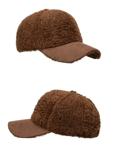 Detail view of brown lamb wool baseball cap featuring premium faux fur and suede visor texture